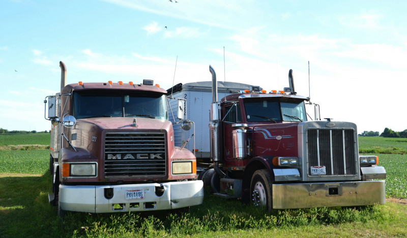 Two Farm trucks used for hauling grain